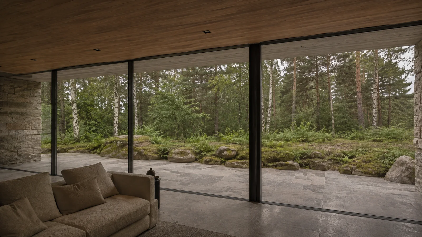 From the living room: glass, reflections and quiet frame lines layer the view into the woodland.